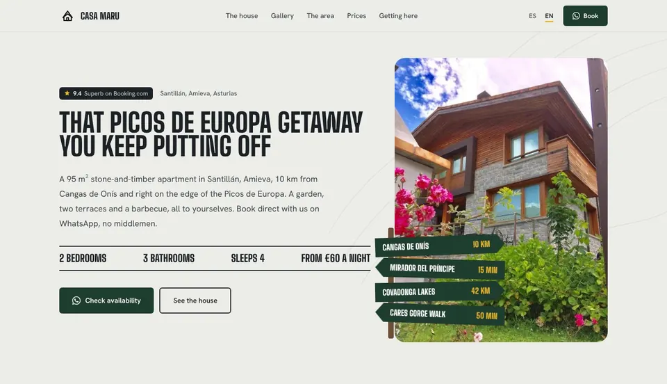 The Casa Maru homepage on a laptop: the headline beside the house with flowers in front and signposts to nearby sights